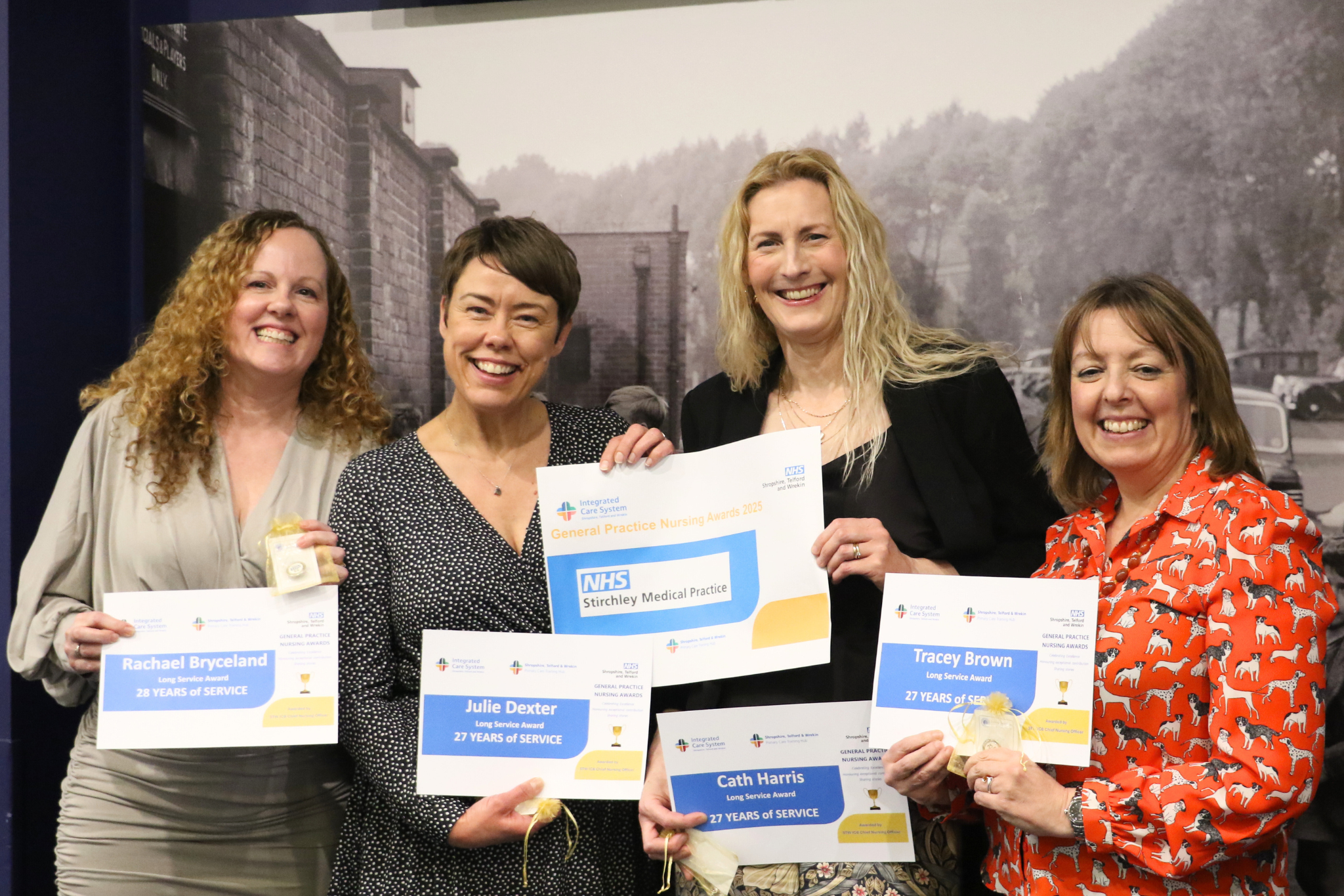 Four General Practice Nurses from Stirchley Medical Practice holding their certificates, smiling